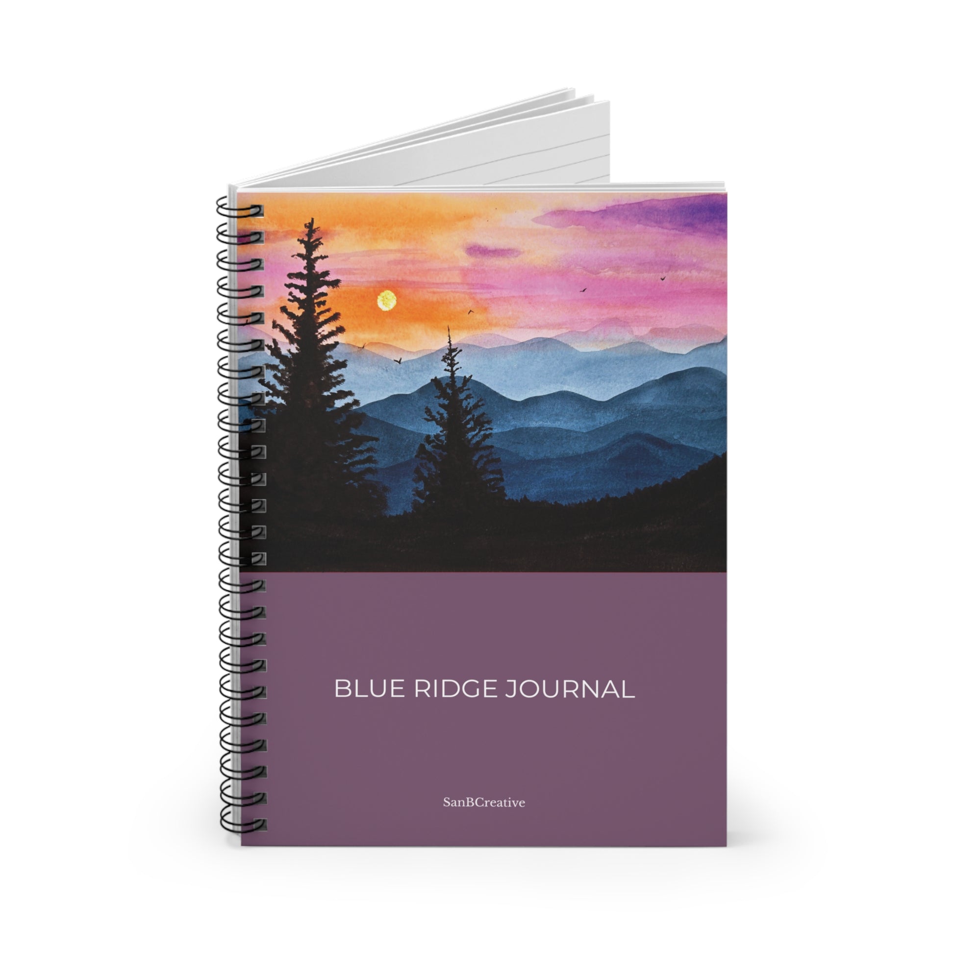 Spiral-bound notebook with a mountain and sunset design on the cover, labeled 'Blue Ridge Journal'.