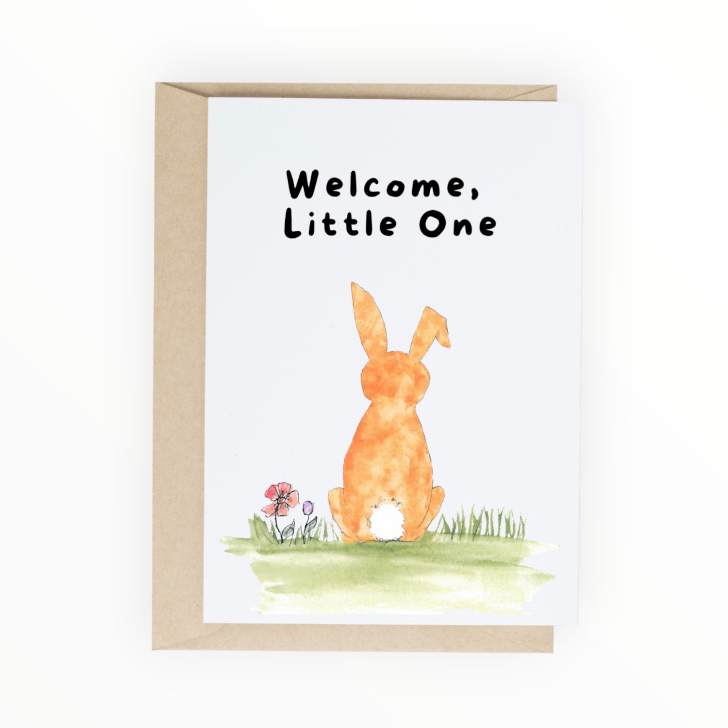 Orange watercolor bunny sitting in grass with the words ‘Welcome, Little One.