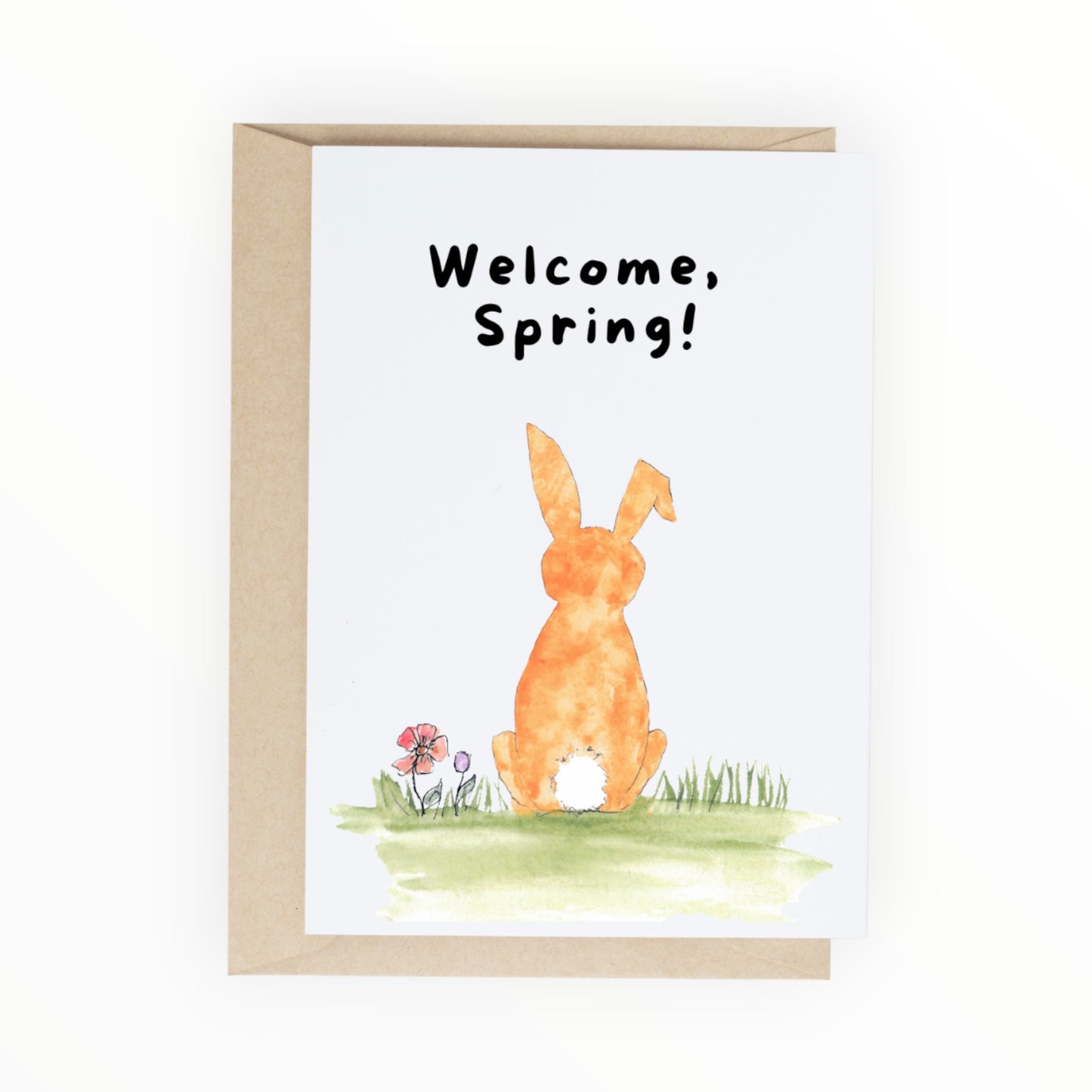 Orange watercolor bunny sitting in grass and flowers with text ‘Welcome, Spring.
